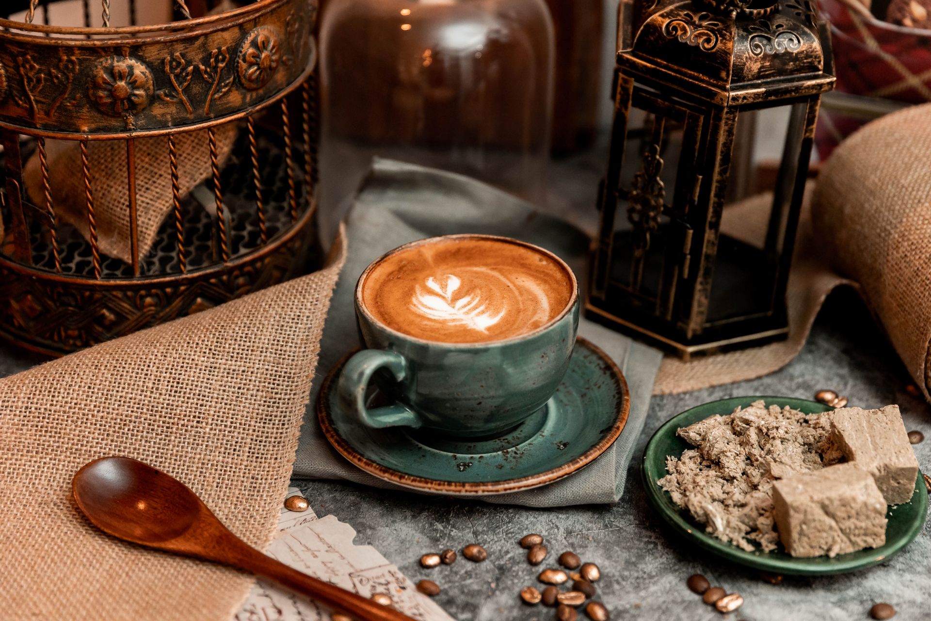 goldstruck cup of coffee surrounded by various spices