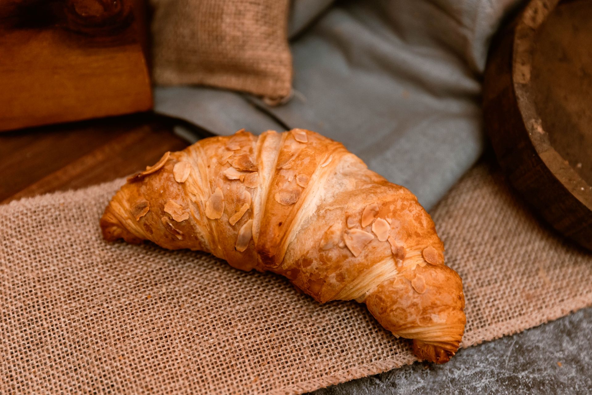 goldstruck warm croissant is placed on a table